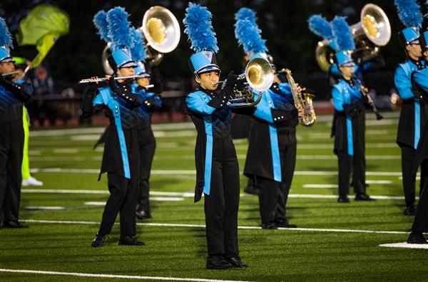 The Centennial High marching band performs